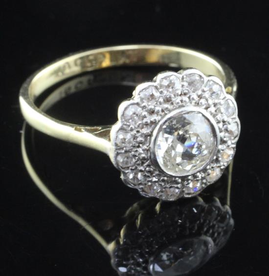 A 1930s/1940s 18ct gold, platinum and diamond cluster ring, size M.